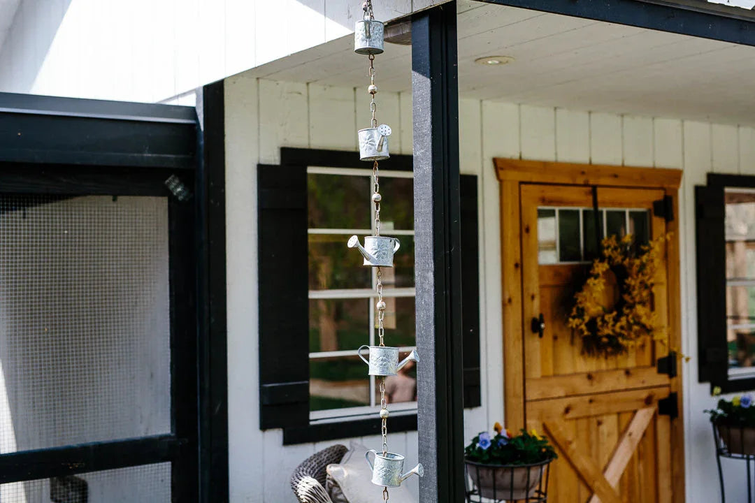 Copper rain barrel in a garden setting