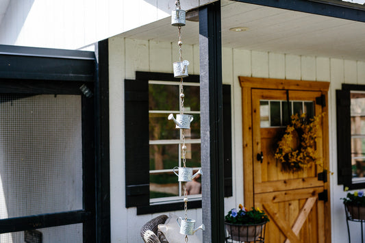 Copper rain barrel in a garden setting